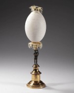Carved ostrich egg on partly gilded bronze base standing man holding a lute. Dated 1848 commemorating the battle of Obligado, Argentina on 20th November 1845 where a joined English-French naval force fought Argentinian forces on the shore of the Parana ri