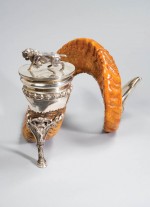 A single ram's horn, mounted as an inkwell in silver. Made by Walker & Hall, Sheffield, 1911.